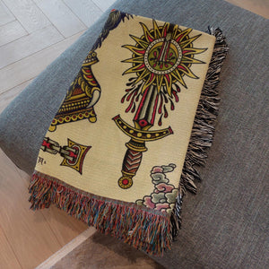 60x80" Eternal Suffering Blanket displayed on a bed emphasizing its vibrant artwork.