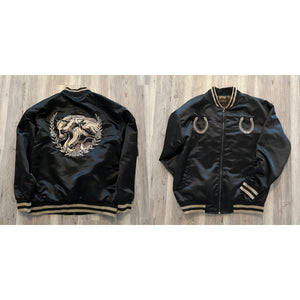 Interior quilted lining of the Year of the Horse satin bomber close-up.