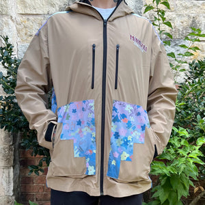 Side view of Thunder Bird jacket showing hood, stash pockets and velcro sleeve cuffs.