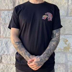 Close-up of Burn Them All T-Shirt showcasing intricate tattoo design and vibrant colors.