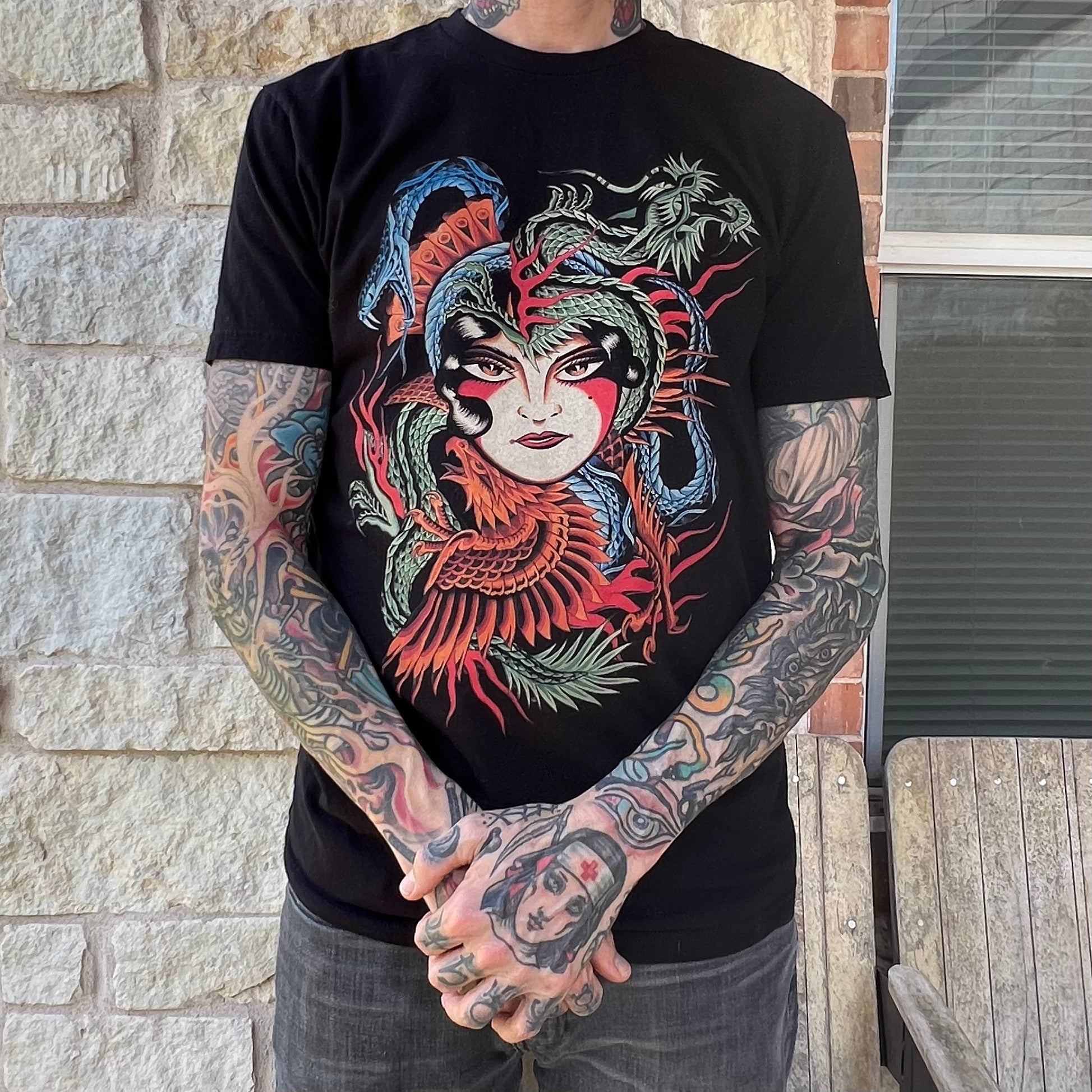 Close-up of Baroness T-Shirt by Clemens Hahn showcasing intricate linework and vibrant colors.