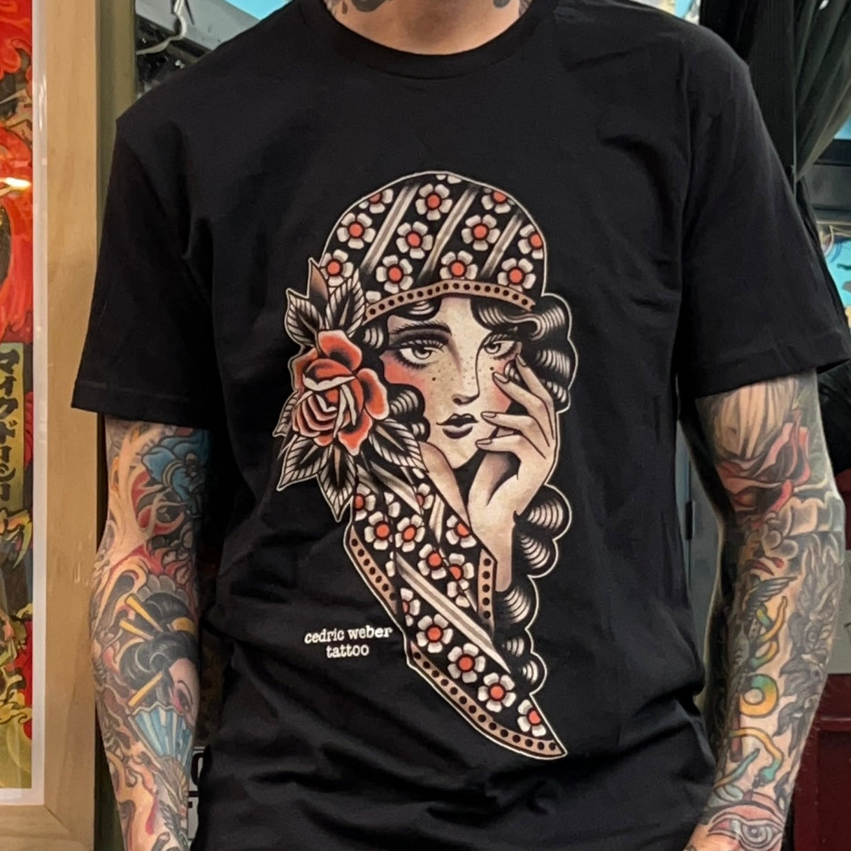 Close-up of Young Girl Shirt by Cedric Weber showcasing intricate linework and vibrant colors.