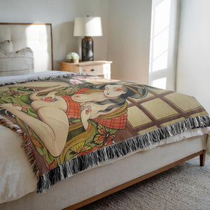 Geisha in the Rose Garden Blanket displayed on a bed – 60x80" woven cotton throw.