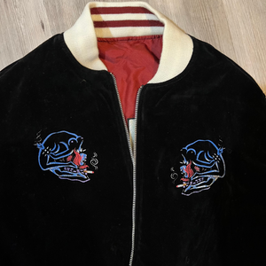 Back view showing bold embroidery on the satin side of the Femme Fatale Jacket.