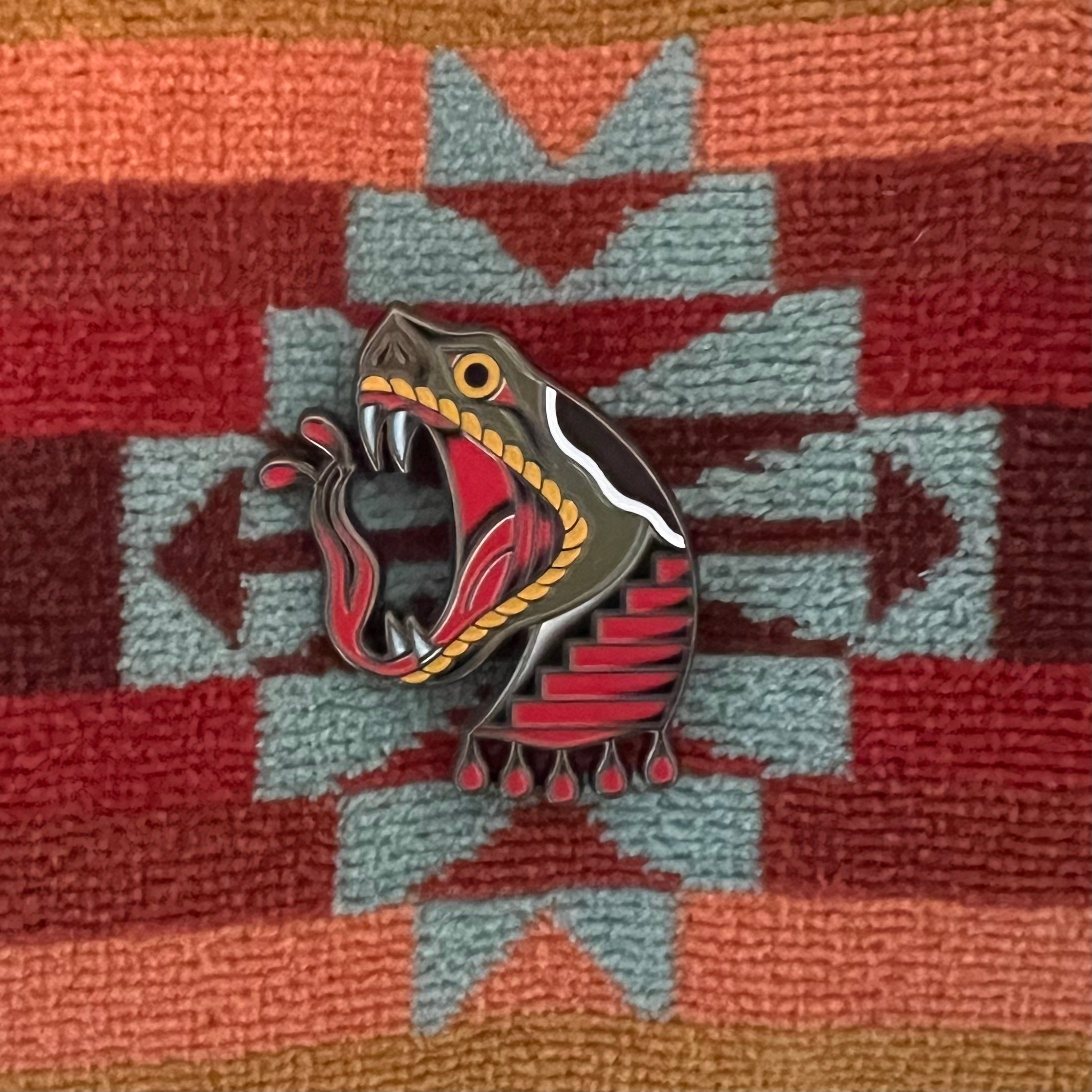 Front view of Portal Snake Pin – 1.5″ soft enamel pin, snake emerges from portal design.