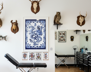 Blue Ryu print by Aaron Hindson framed and displayed on wall.