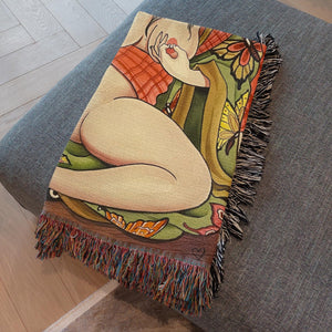 Geisha in the Rose Garden Blanket displayed on a bed – 60x80" woven cotton throw.