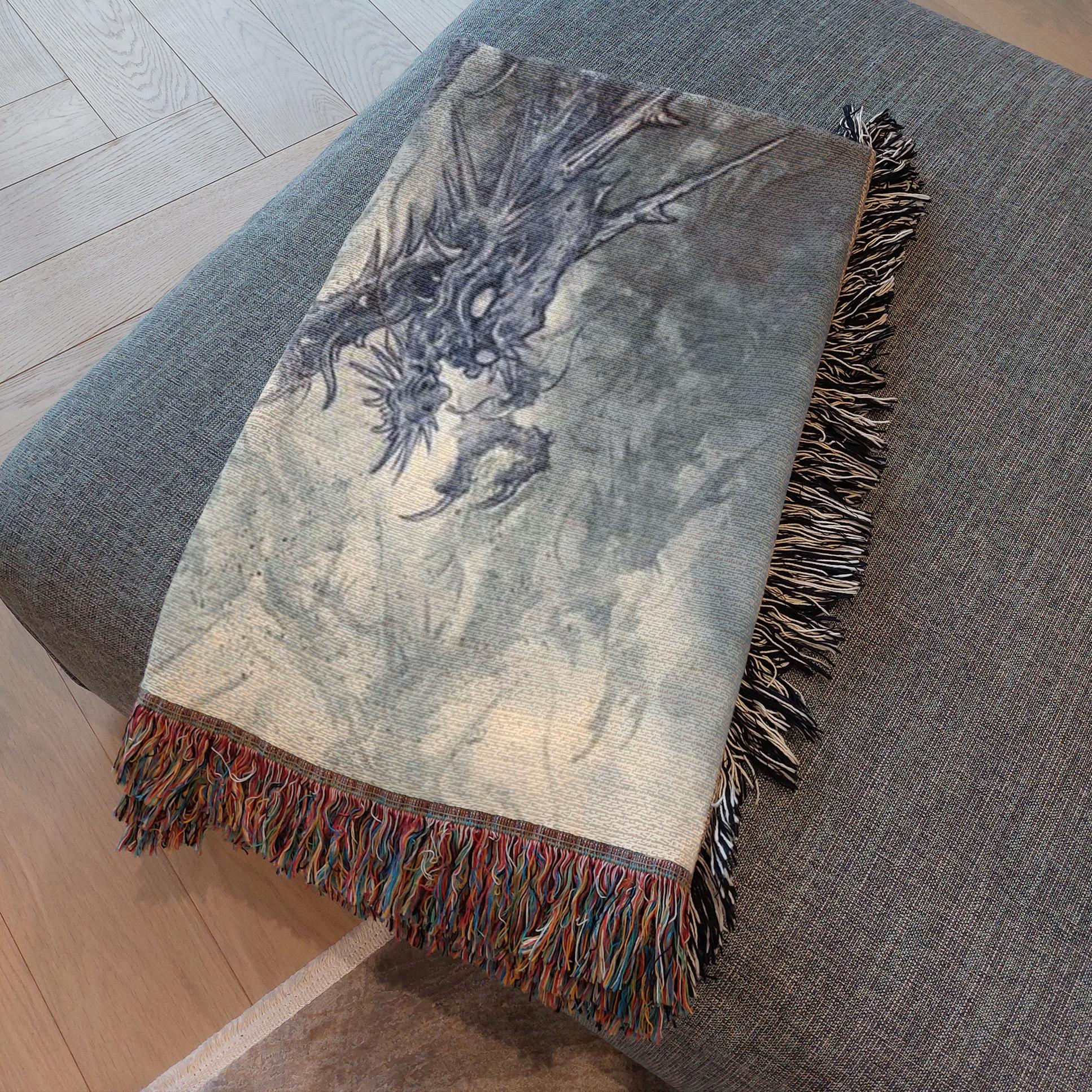Jojo Ackermann's Dragon Blanket displayed on a bed – 60x80" woven cotton throw.
