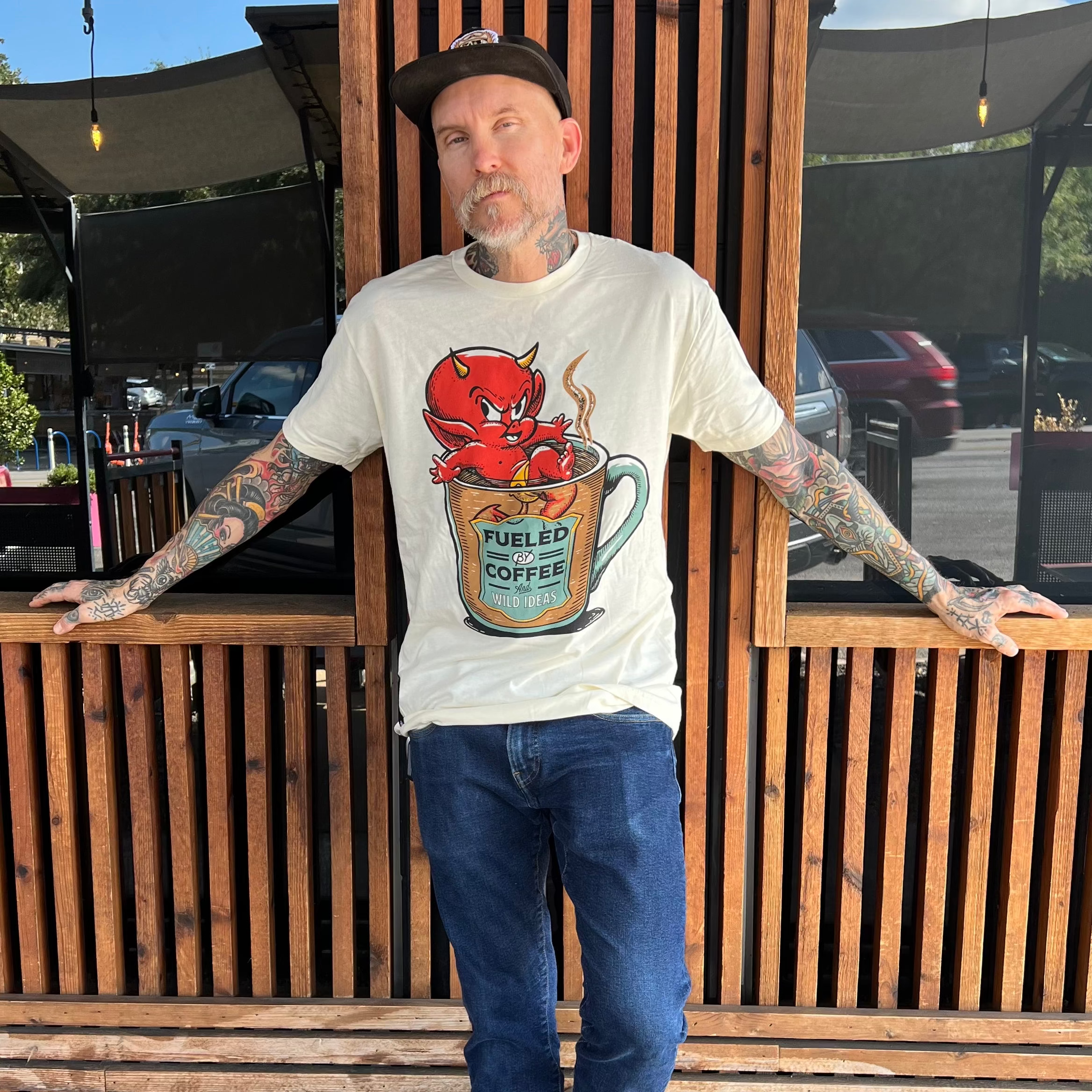 Lifestyle image: model wearing Hot Coffee Tee by Mindzai Apparel.